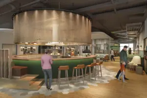 A large room with a bar and several people.