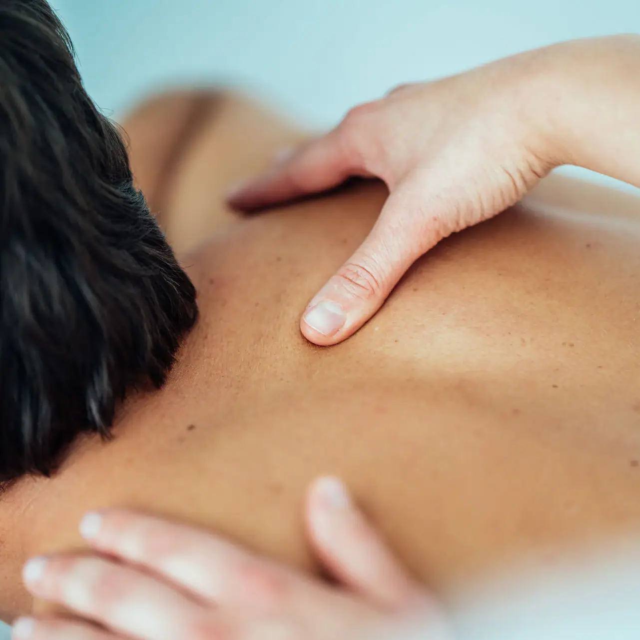 Back massage One person receives a back massage.