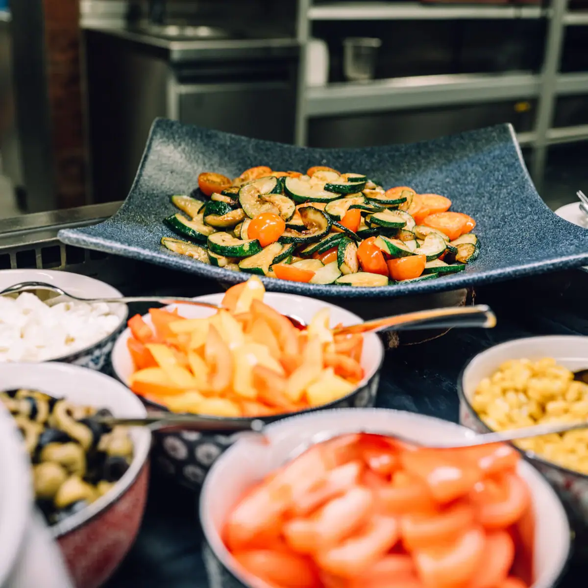 A group of bowls with various dishes.