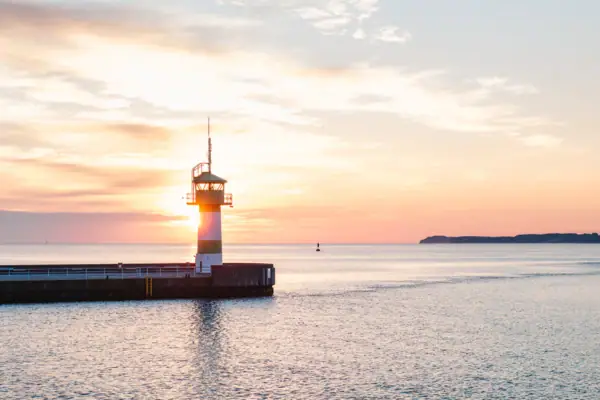 Lighthouse on a jetty in the middle of the ocean