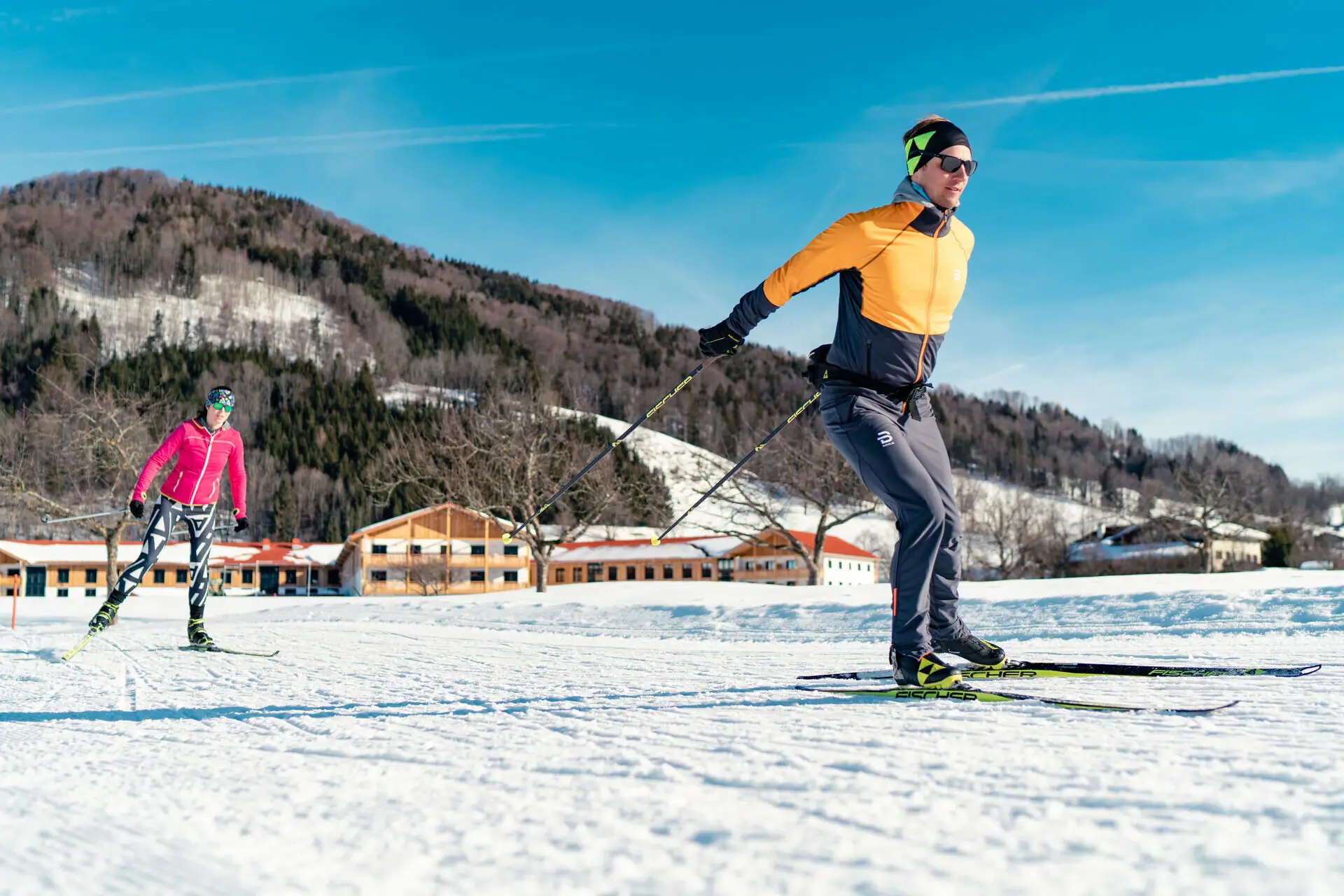 Cross-country skiing A man skiing on a snowy slope.