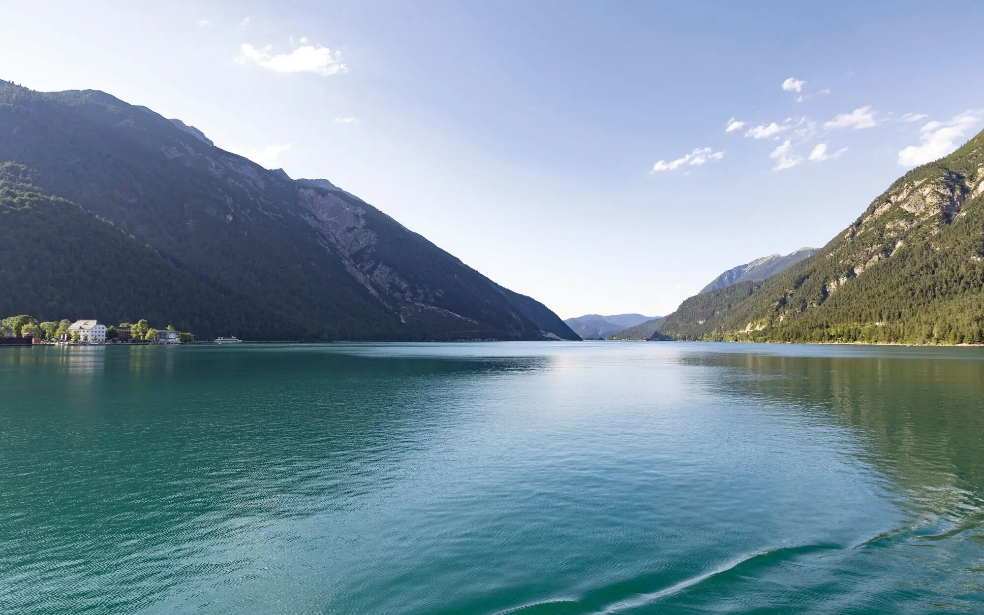 View of a fjord with mountains in the background.