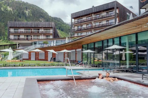 A couple in an outdoor hot tub.