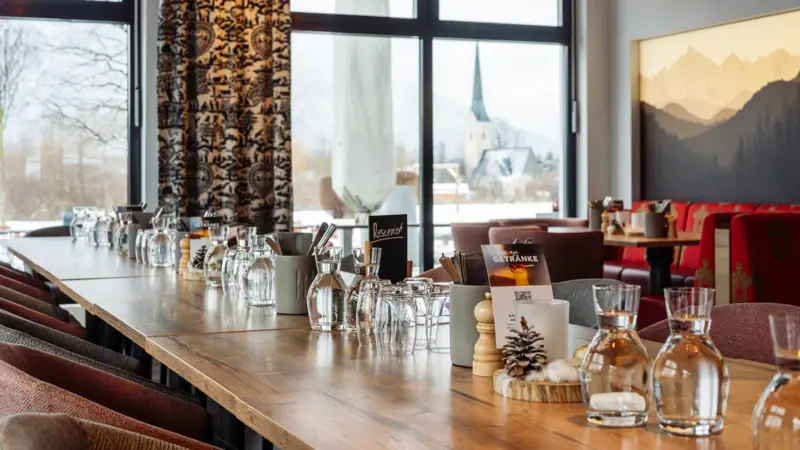 A table with glasses and a few glasses on it.