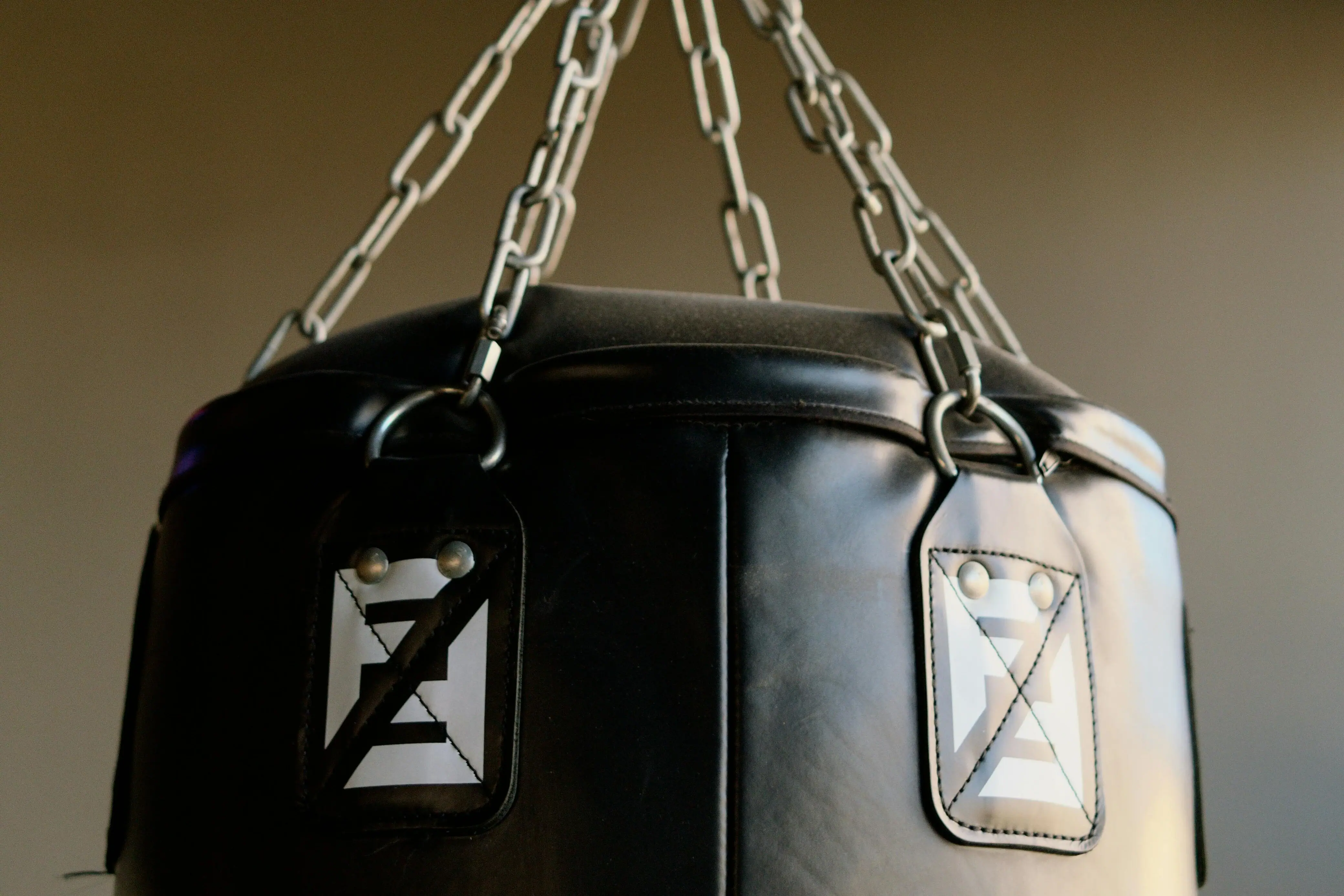 A punching bag hanging on a chain.
