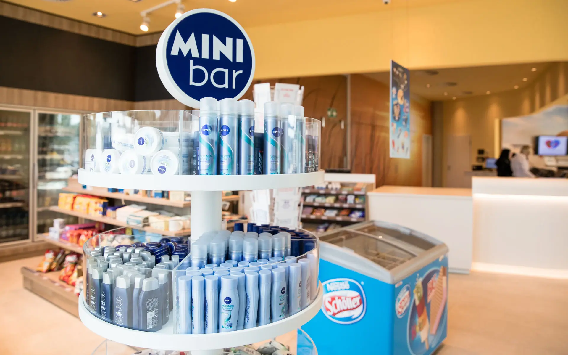 Interior view of a small shop with shelves and a freezer cabinet 