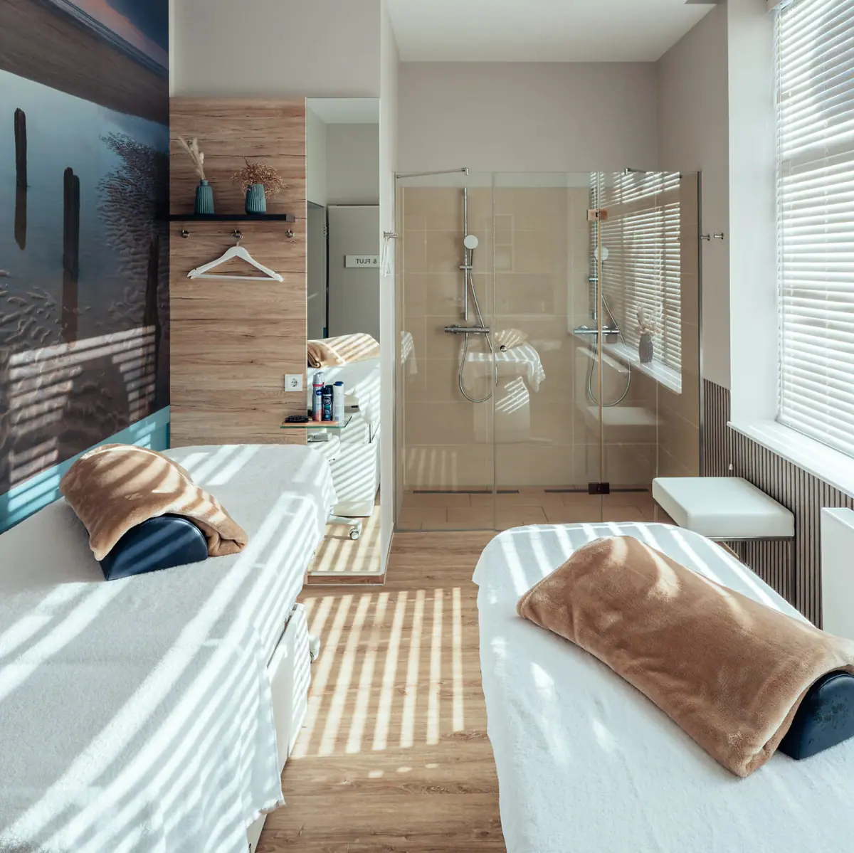 A room with two beds and a shower.