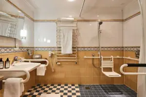 A bathroom with a washbasin and a shower.
