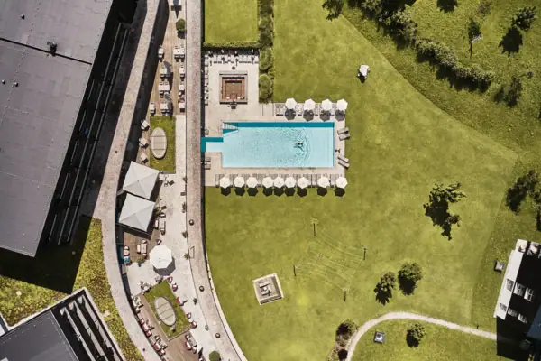 Aerial view of a swimming pool and a lawn