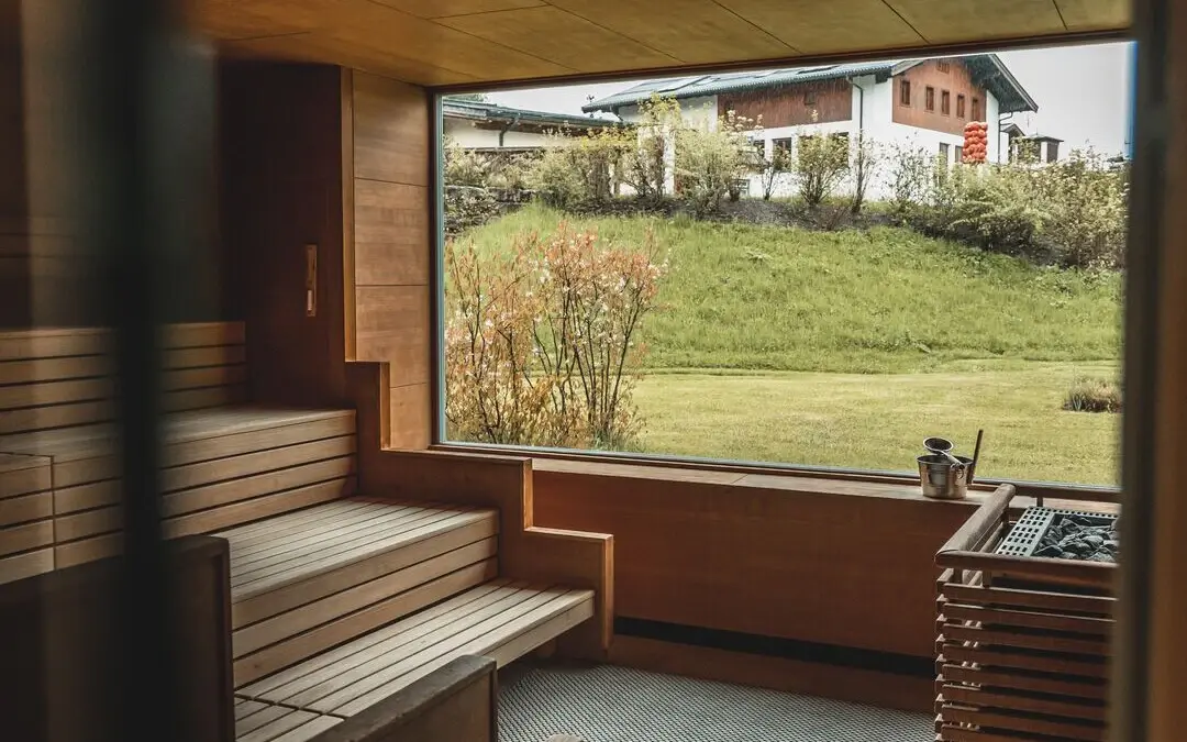 Sauna at aja Werfenweng with benches and window.