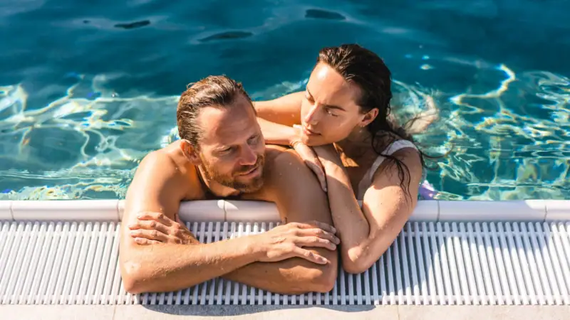 A man and a woman in the swimming pool.