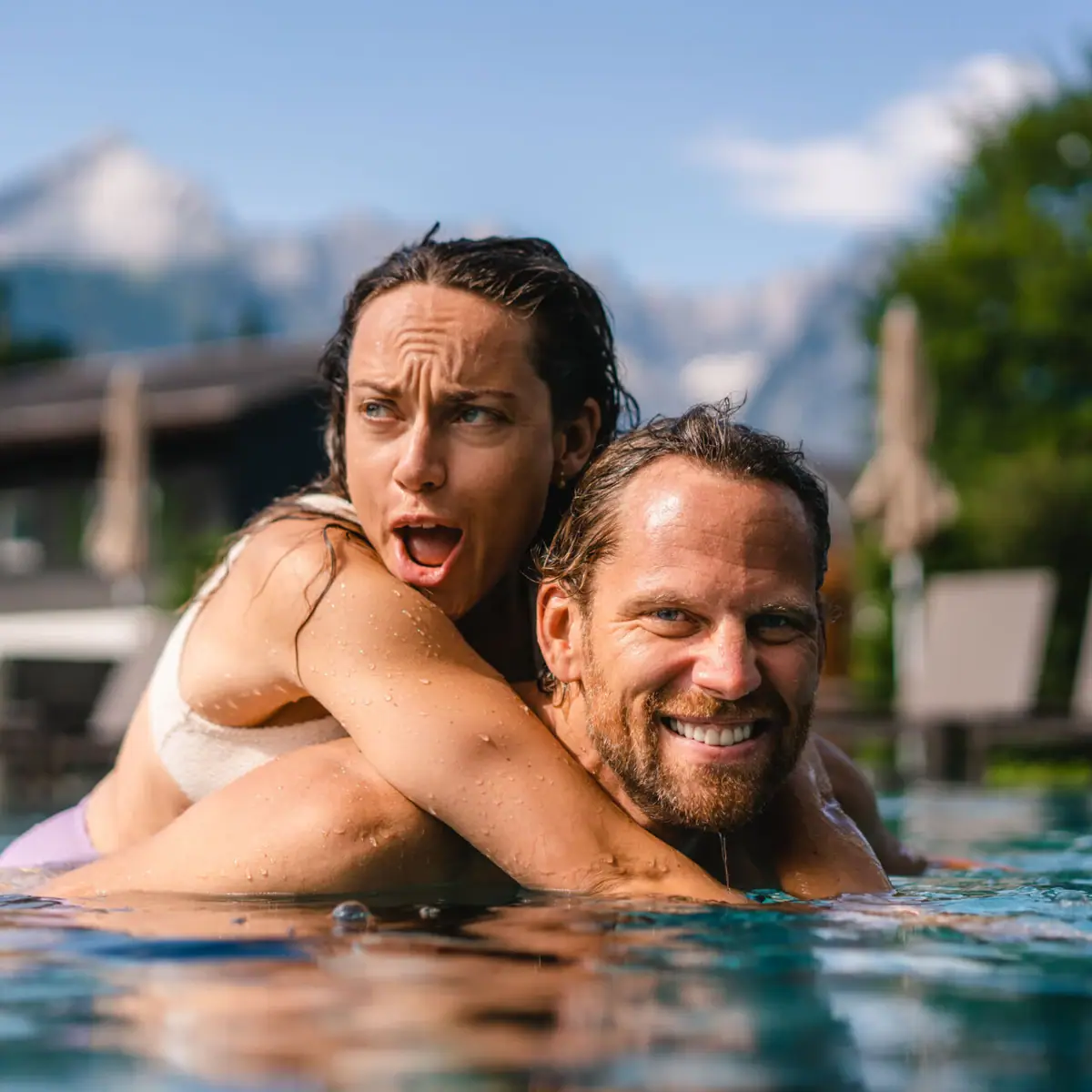 A man and a woman in the swimming pool.