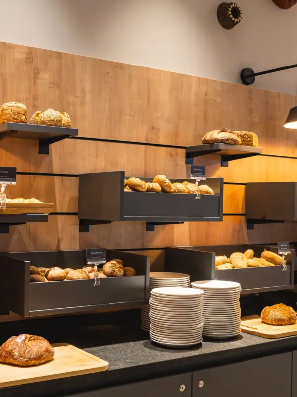 A display of bread and plates at a buffet
