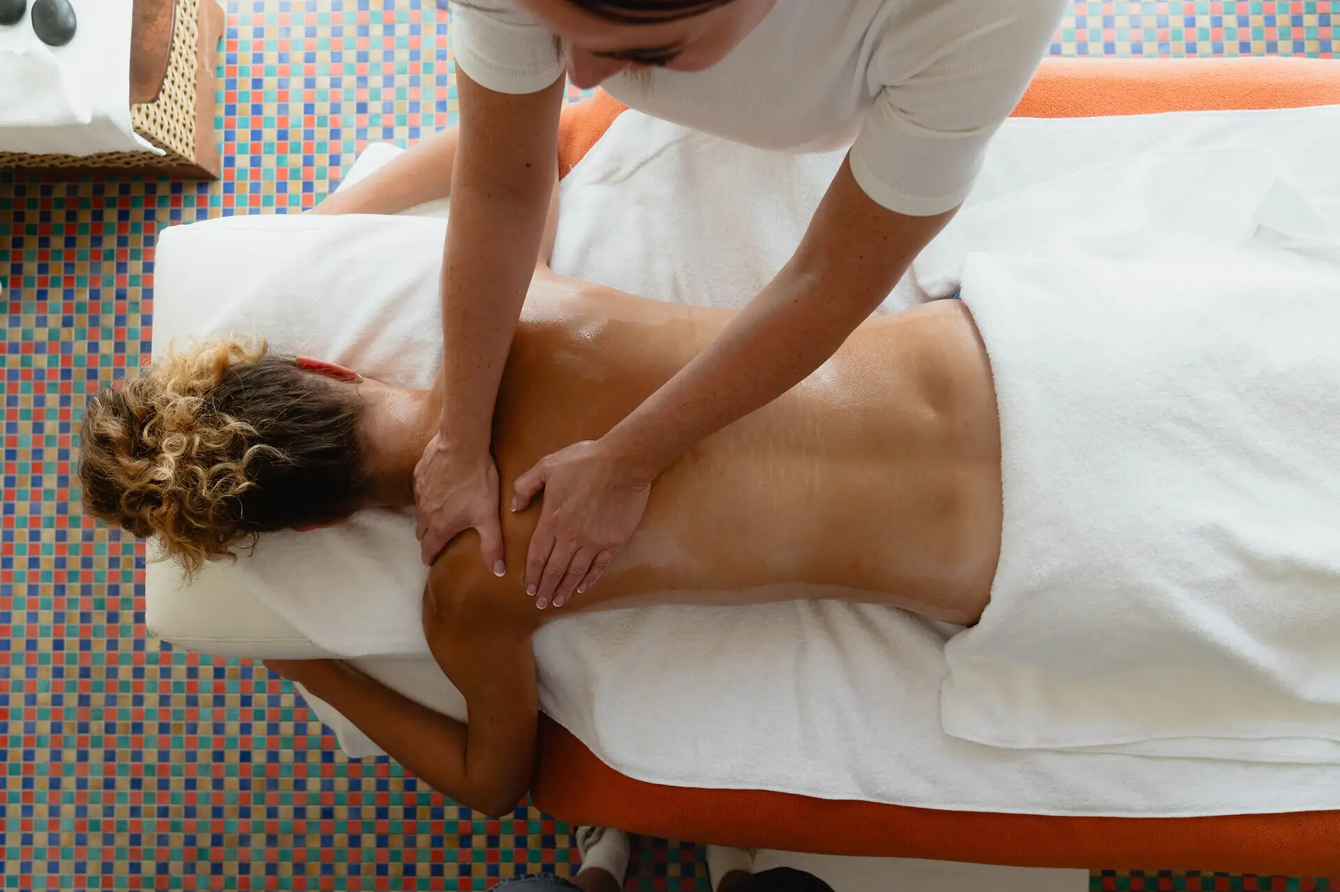 Woman receiving a back massage indoors.