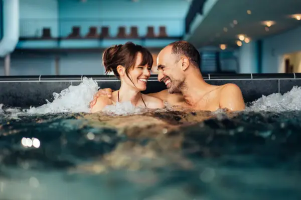 A man and a woman in a whirlpool.