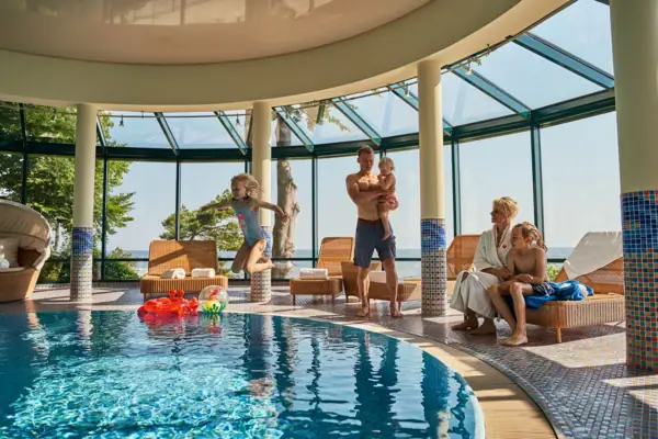 Indoor pool A group of people at a swimming pool.