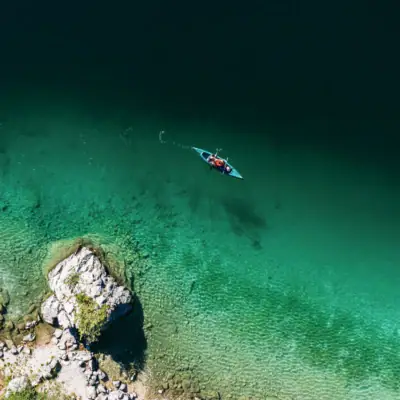 Kayak Eibsee A person in a kayak on the water.