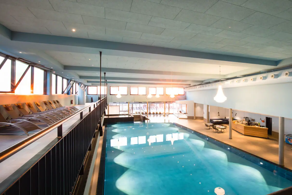 An indoor swimming pool with clear water.