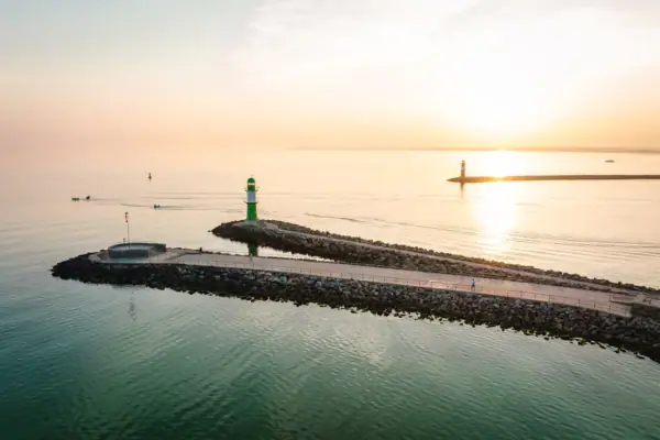 A pier with a lighthouse on it.