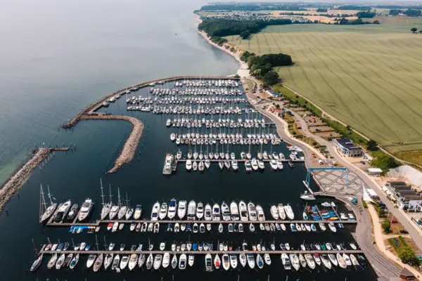 A marina with many boats and a body of water.