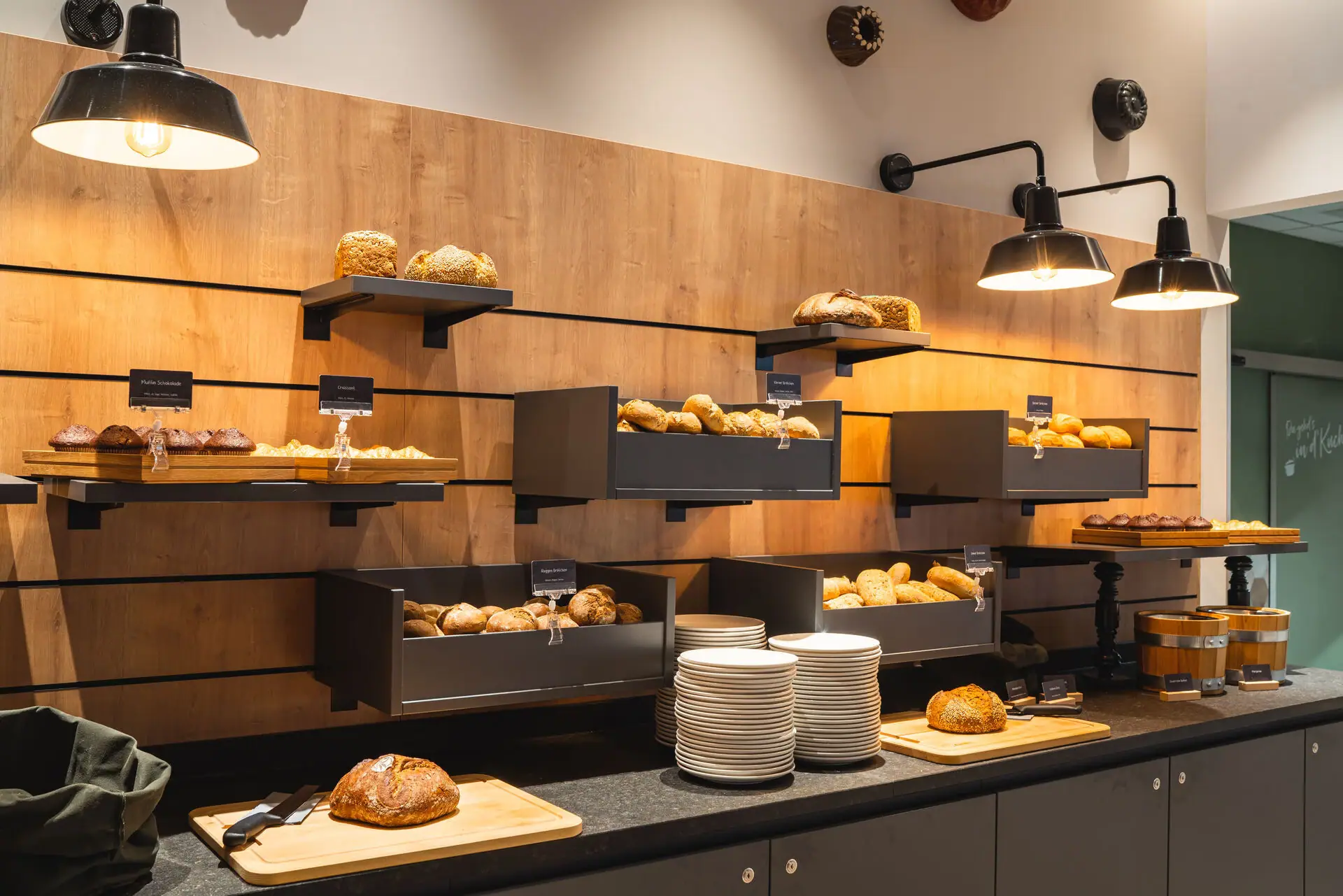 Bread and rolls A selection of bread and plates on a counter.