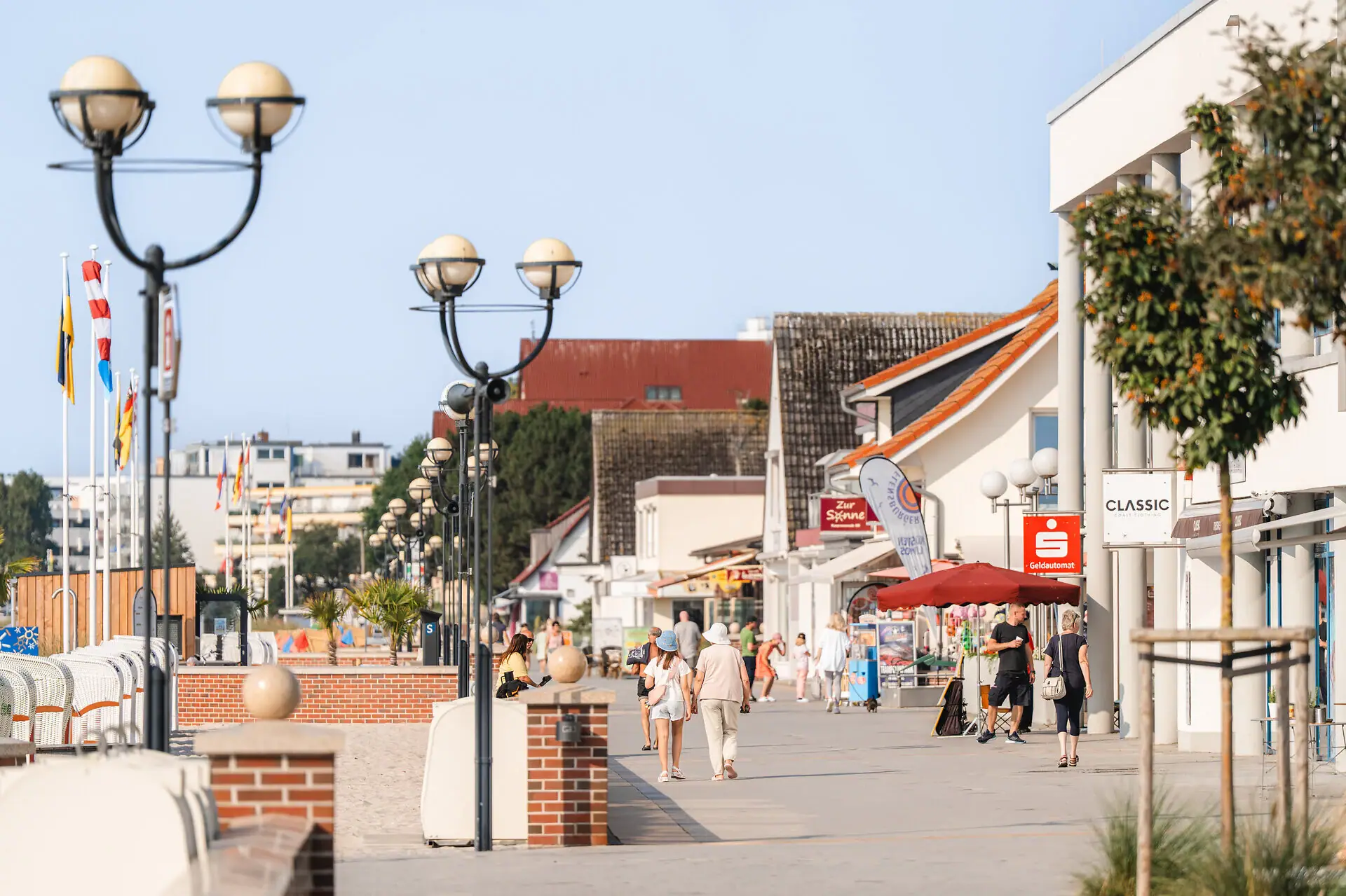 A group of people walking on a pavement.