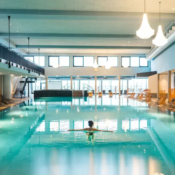 A woman in a swimming pool.