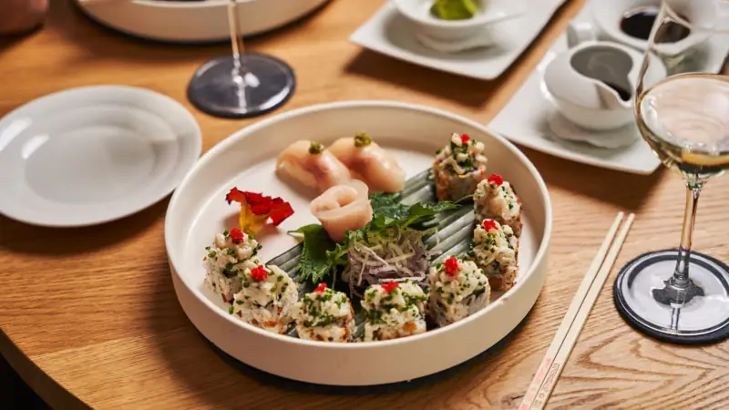 Sushi A plate of sushi on a table.