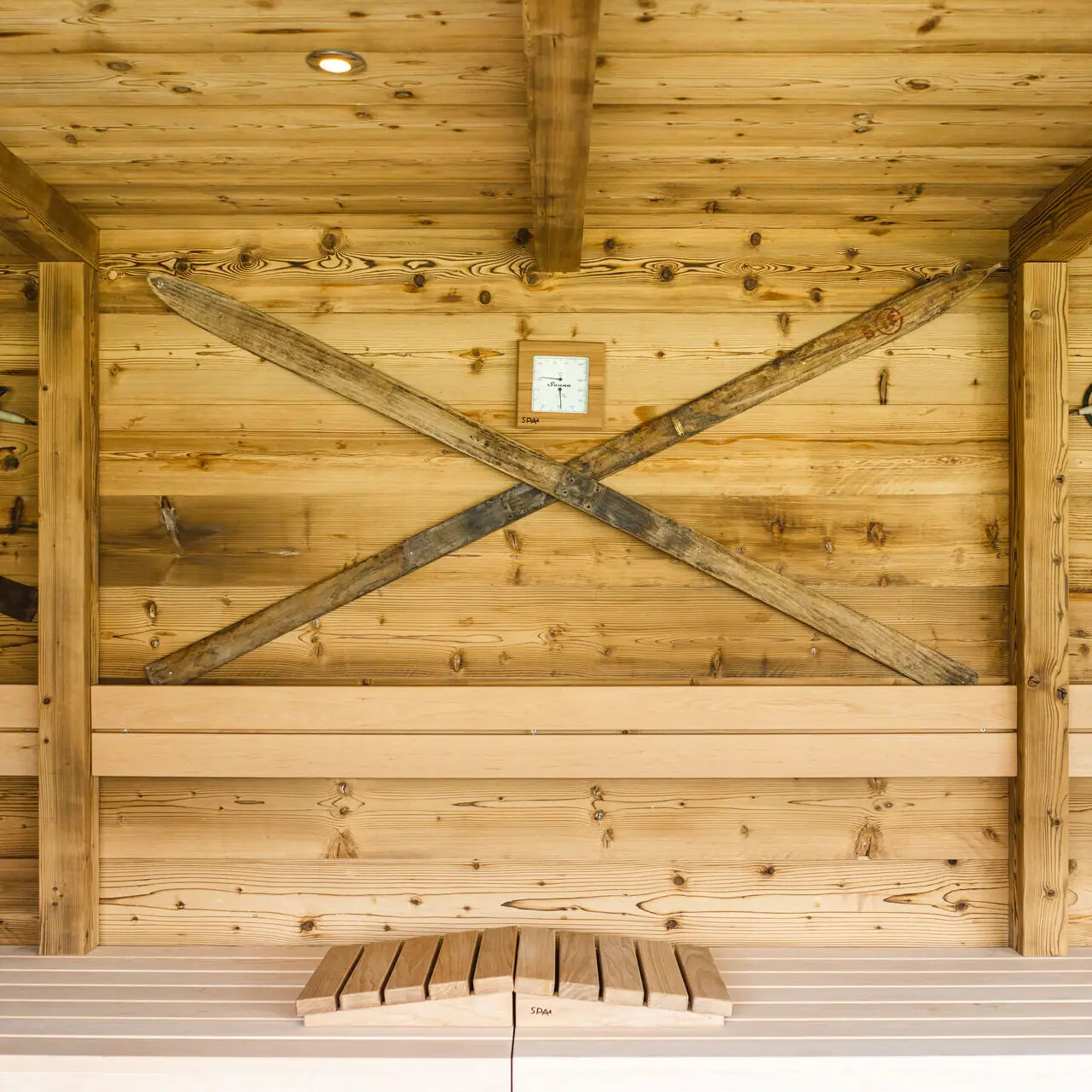 Sauna Wooden construction with clock and cross