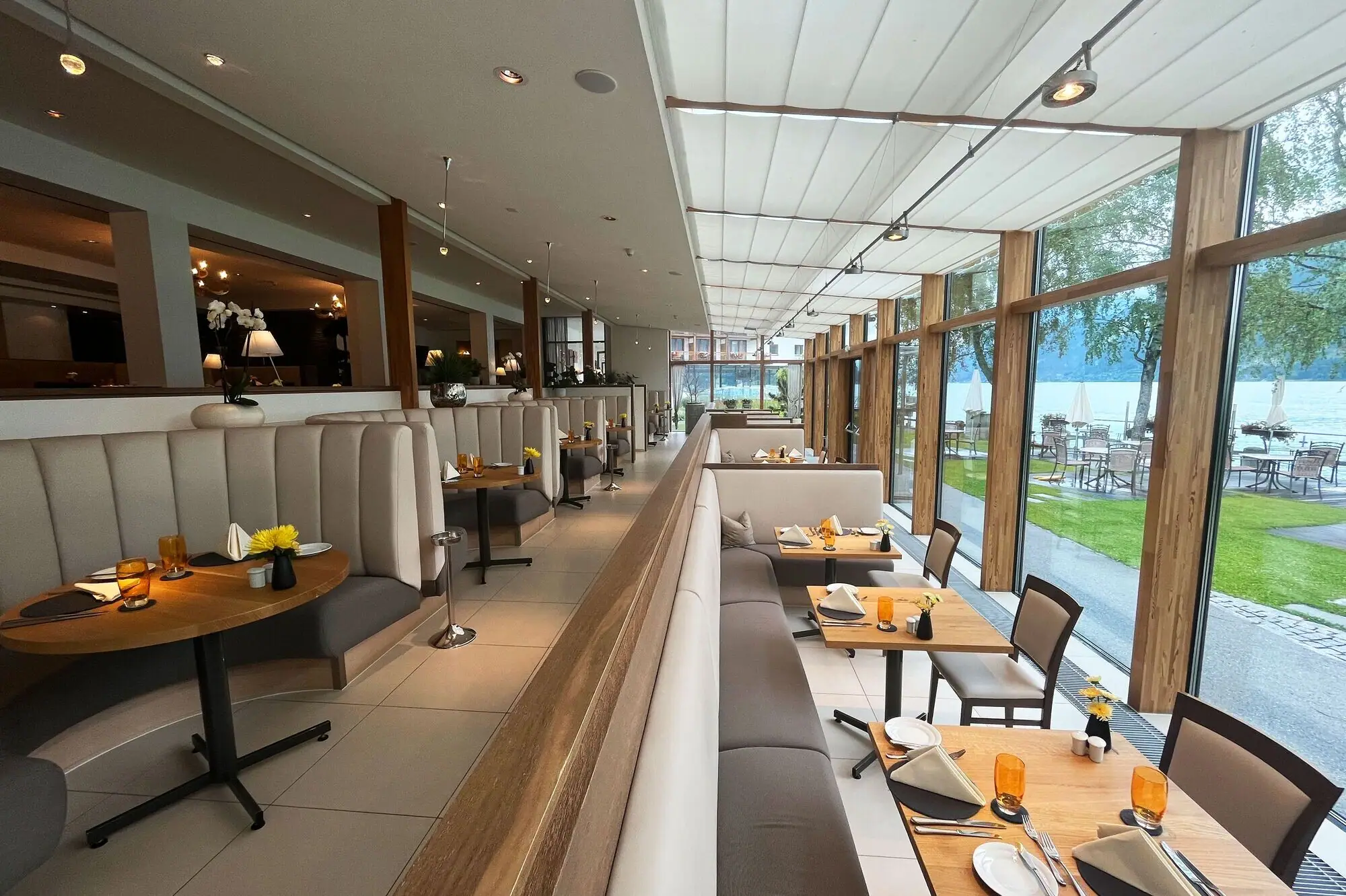 Interior view of a restaurant with tables and chairs.