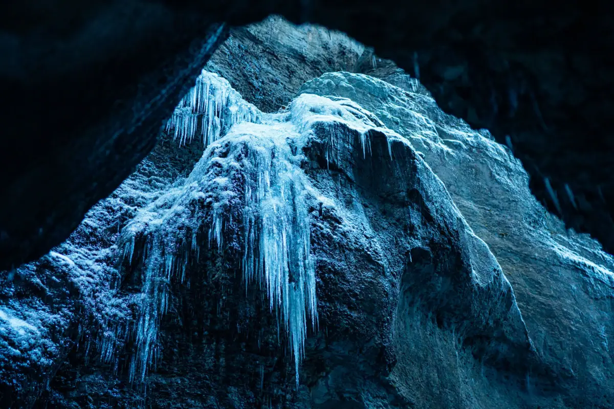Icicles hanging from a cliff in the Partnachklamm gorge in winter.