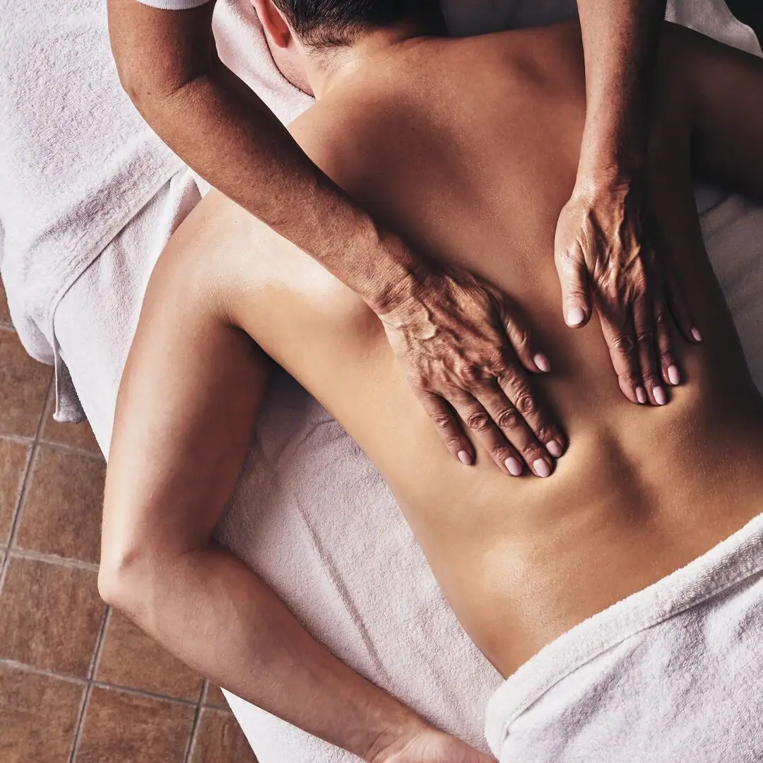 One person receives a back massage.
