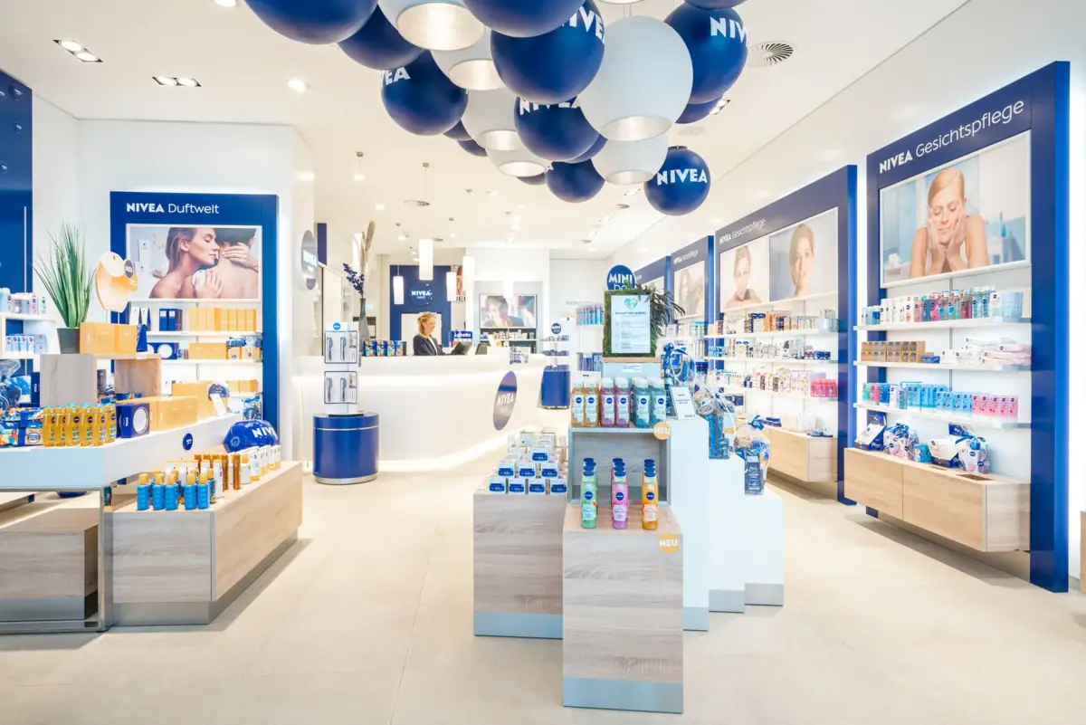 A shop with blue and white balloons on the ceiling.