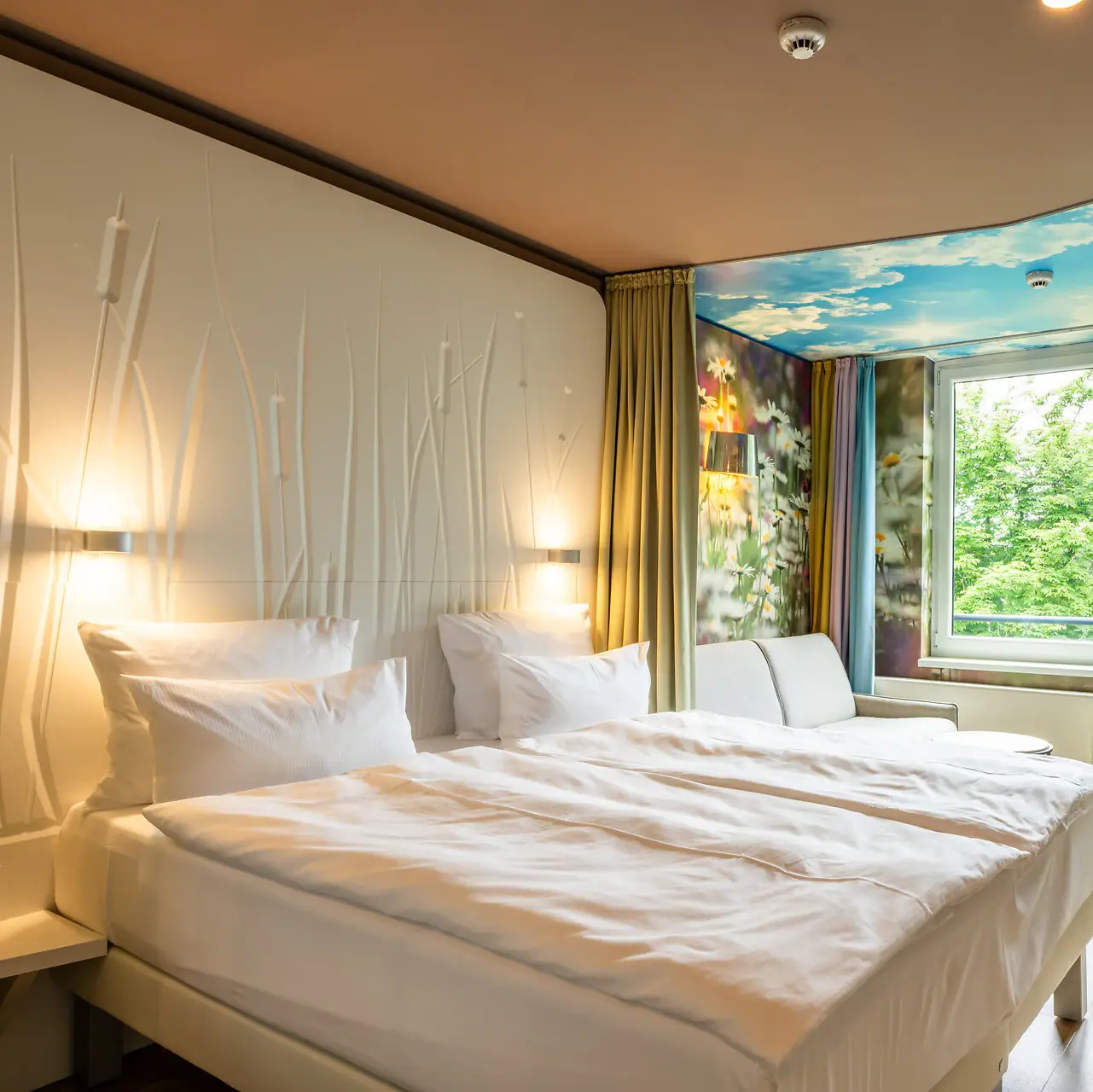 Rooms and suites A room with two beds and a window.