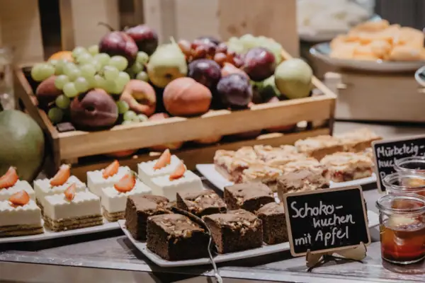 Selection of cakes, chocolate cake and fruit