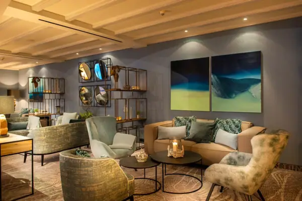 Interior with sofa, armchairs and coffee table.