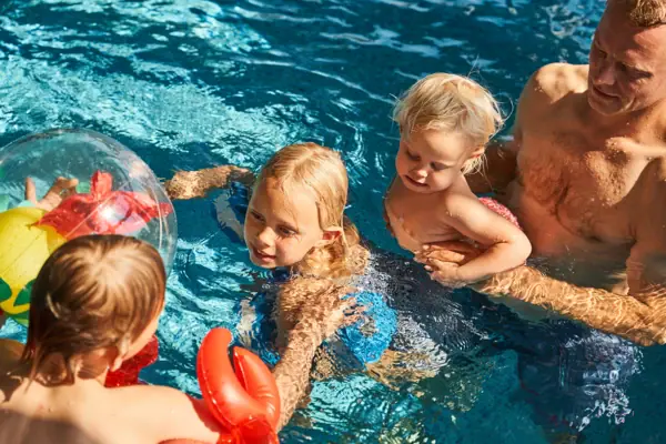 A group of children at the swimming pool.