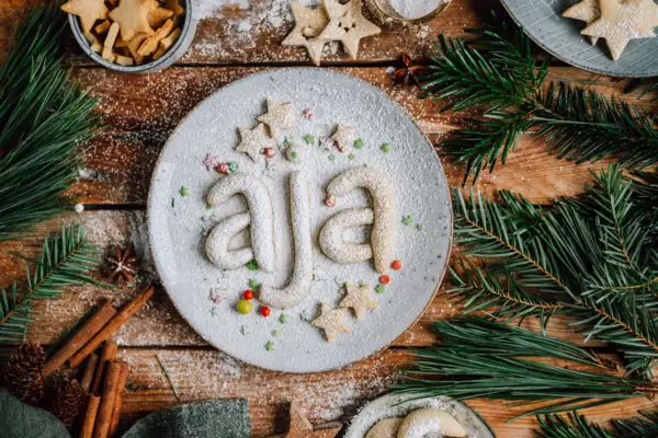 Plate with biscuits and sugar on top