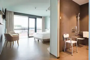 Disabled-friendly room A room with a bed and chairs.