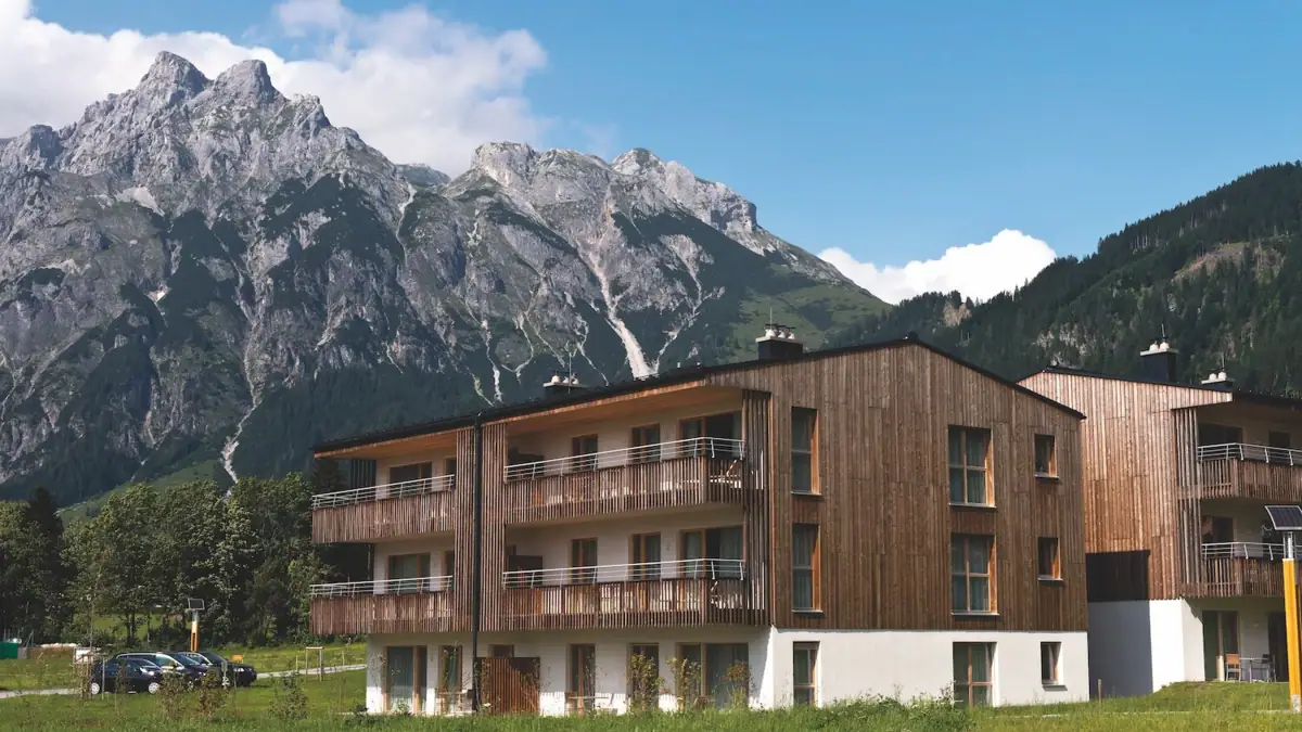 Holiday flats Werfenweng A building with a mountain in the background.