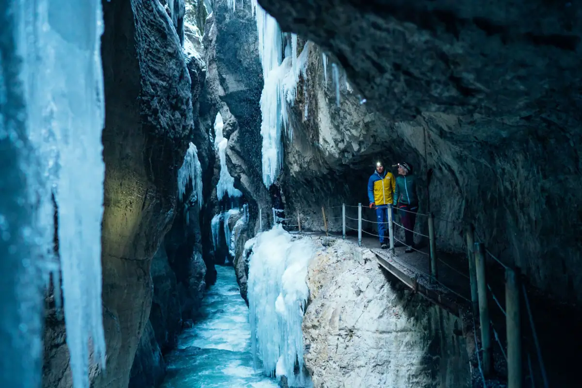 People standing on a bridge in the Partnach Gorge.