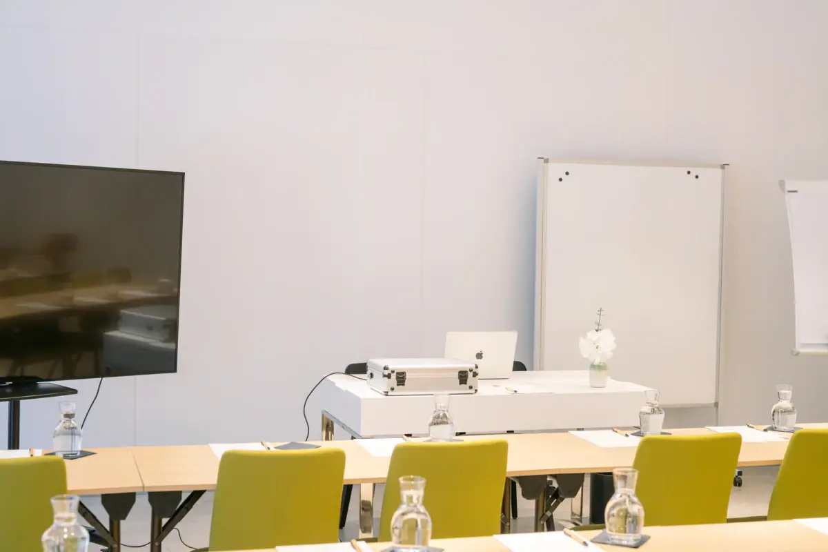 A room with tables and chairs.