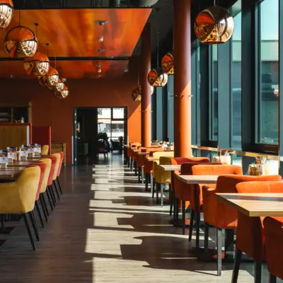 A room with tables and chairs.