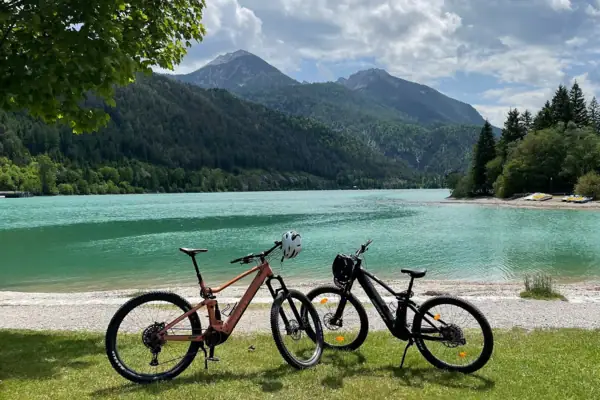 Two bicycles next to a body of water