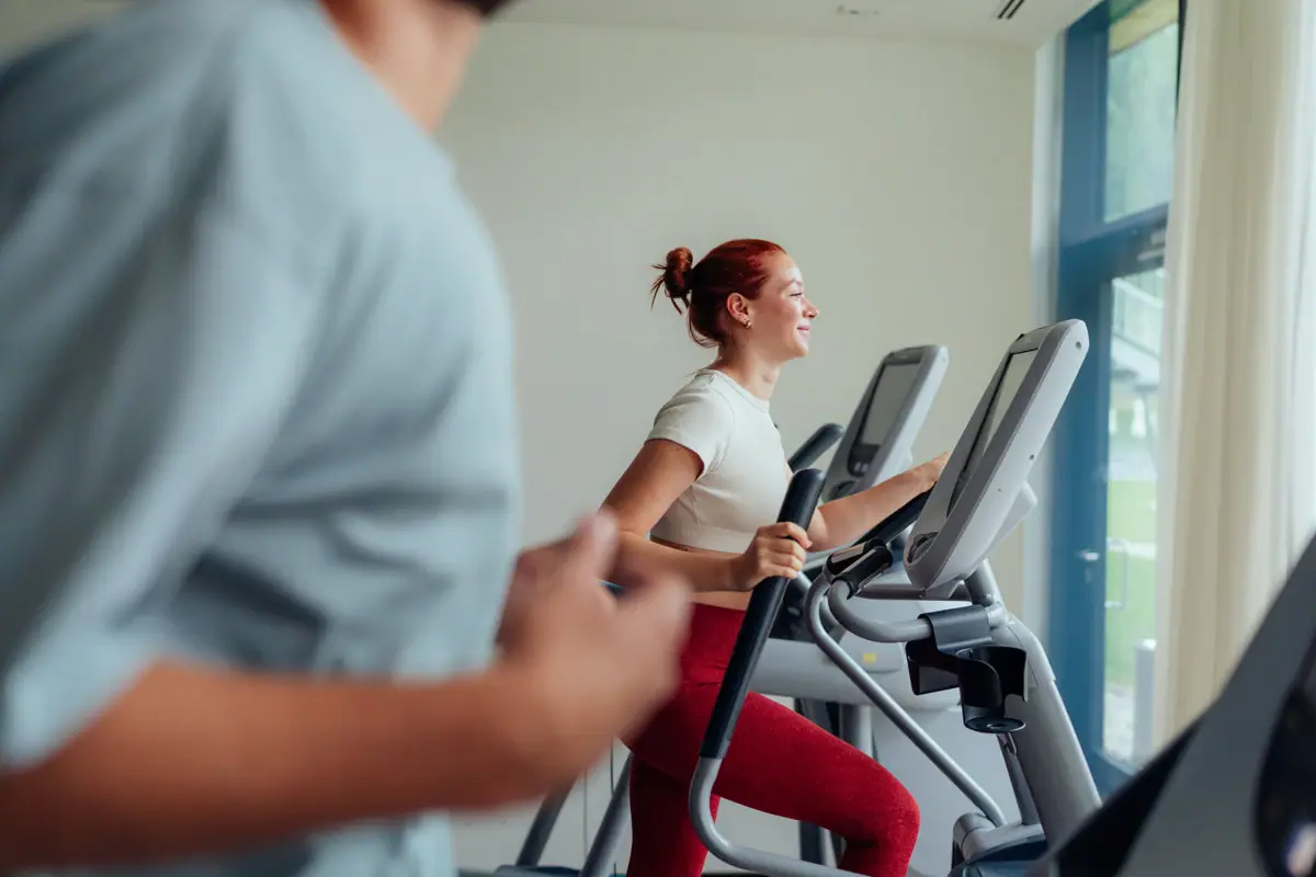A woman exercising on a treadmill
