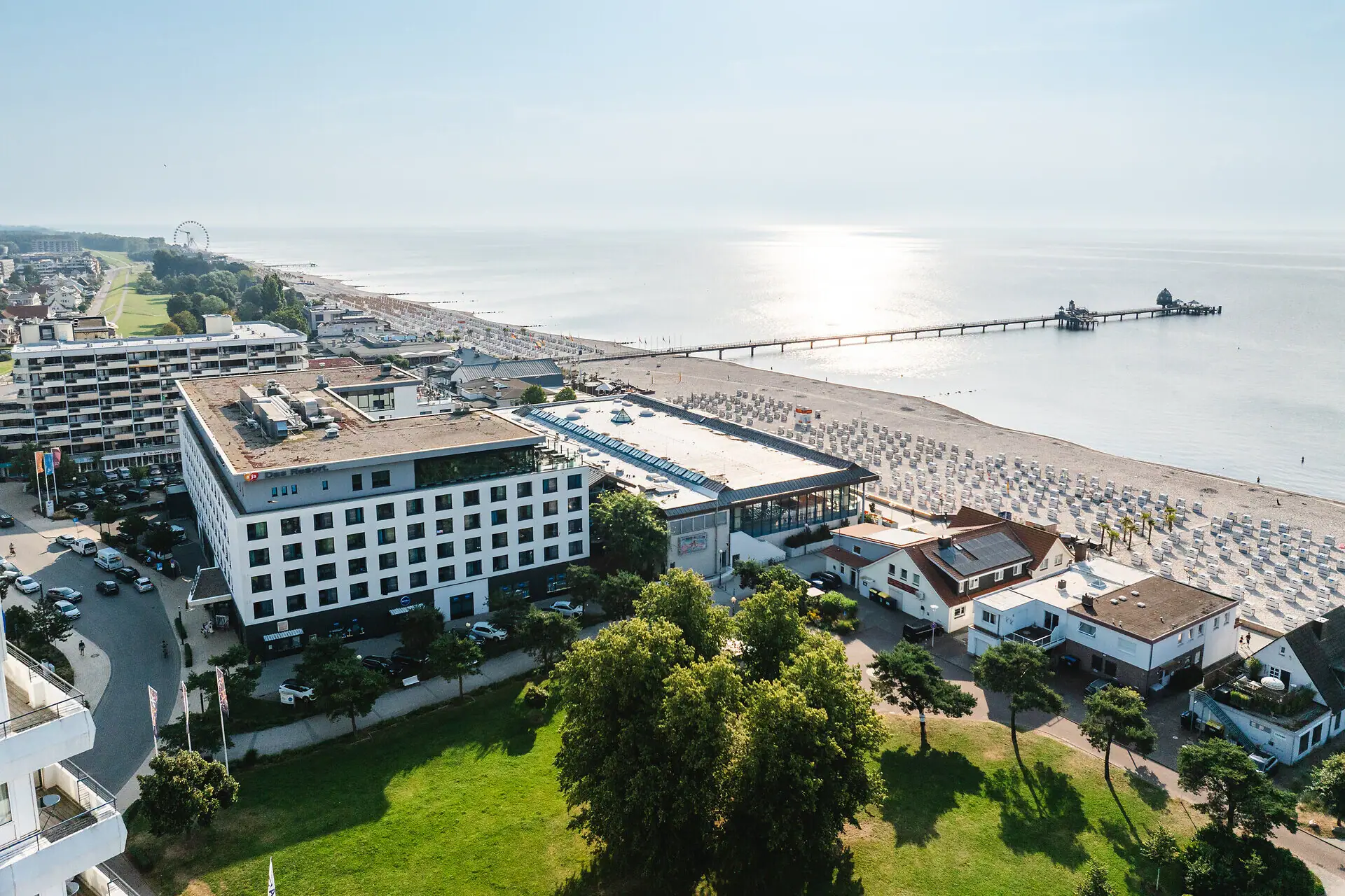 aja Grömitz A building next to a body of water.