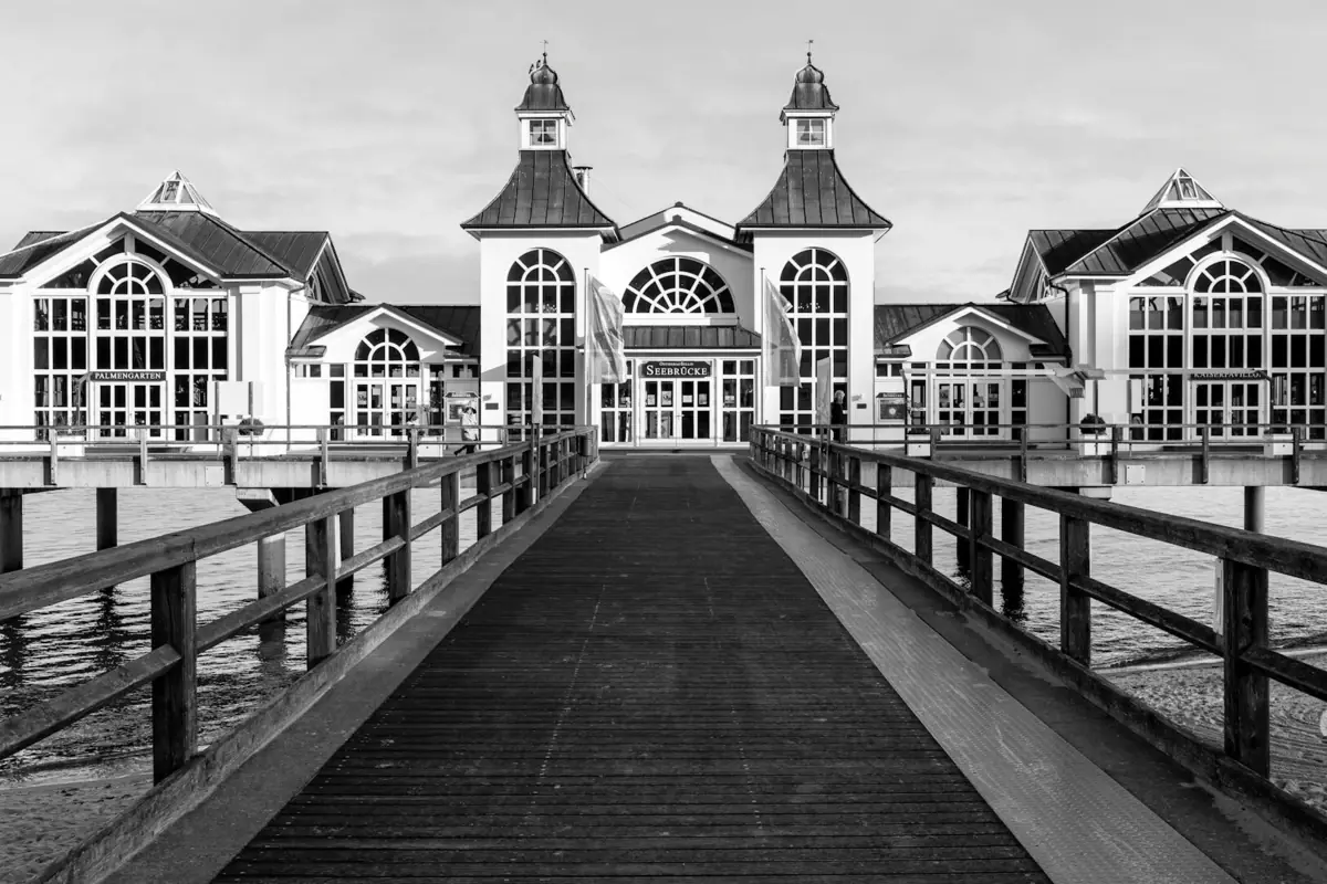 A footbridge leads to a building.