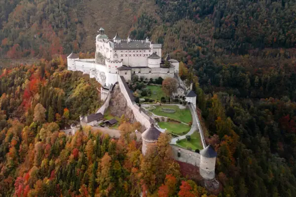 Castle on a hill with trees in autumn.