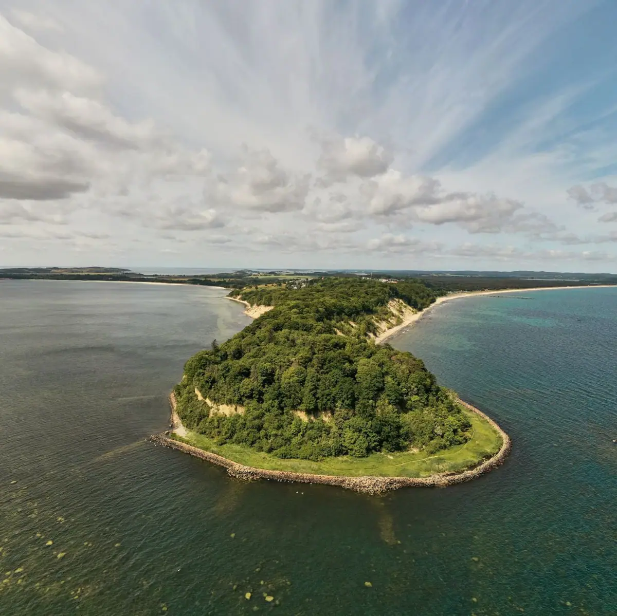 An island surrounded by water.