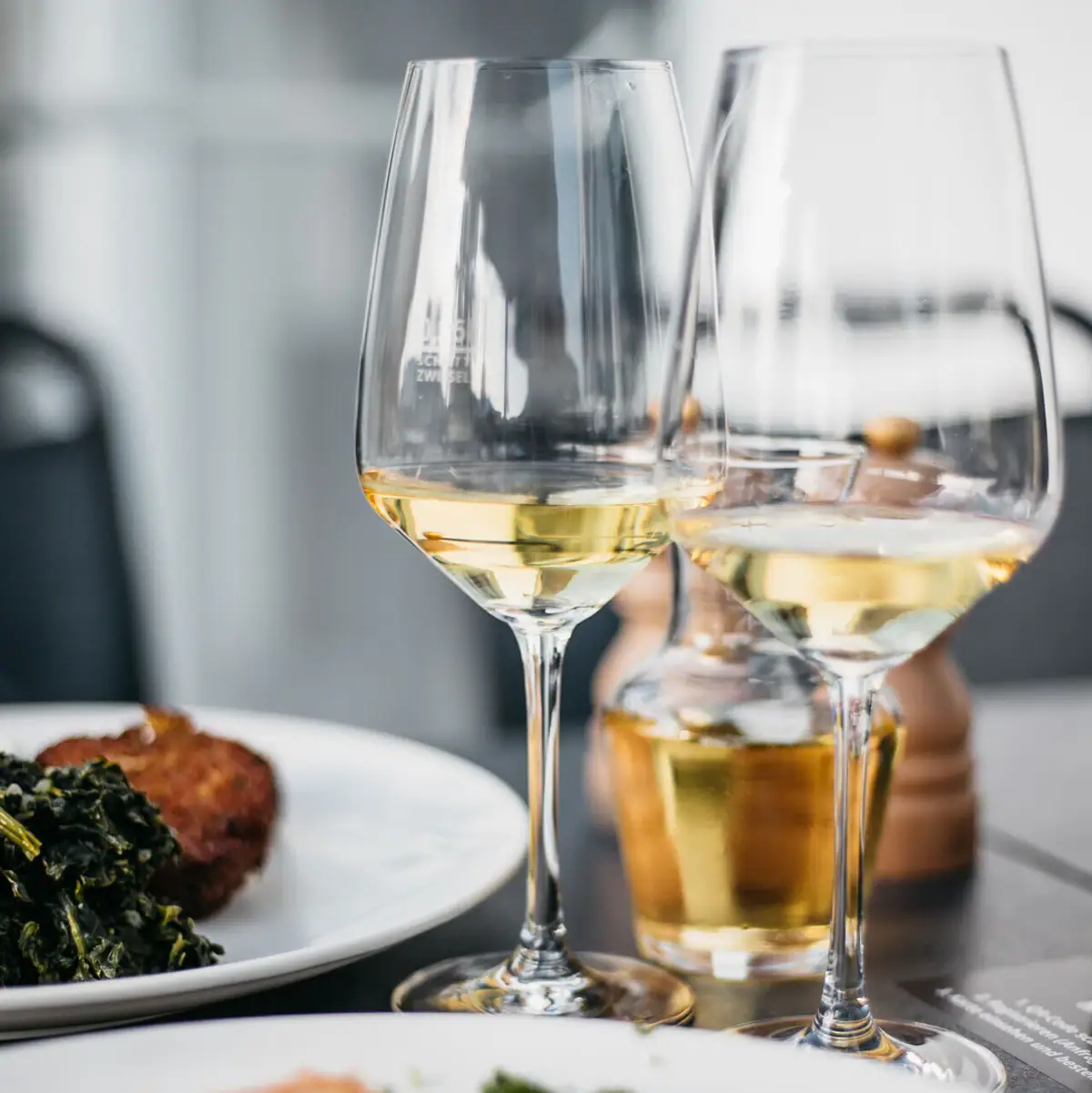 A group of wine glasses on a table.